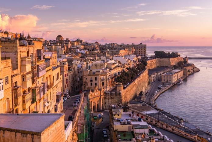 Valletta, Malta - The traditional houses and walls of Valletta Grand Harbour at sunrise