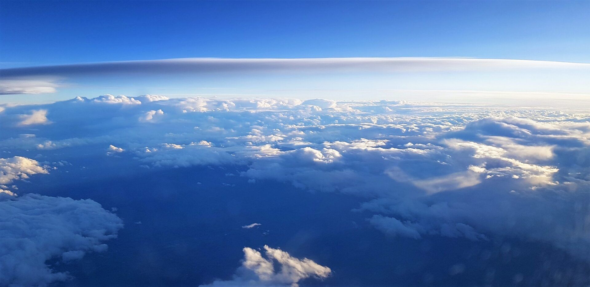 Beautiful scenery of the earth and white clouds seen from a plane