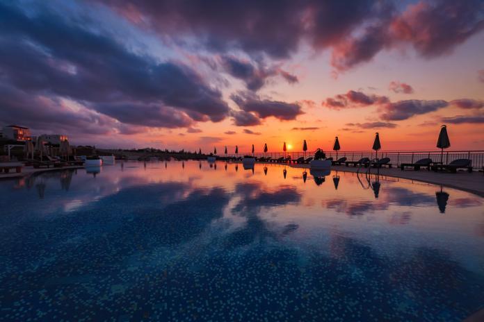 Poolside sunset and reflections crete