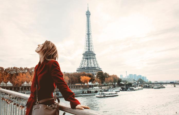 Style girl in Paris with Eiffel tower on background
