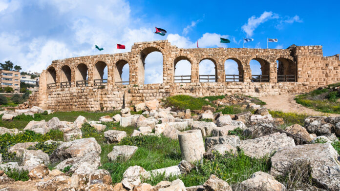 wall with flags in Jerash (ancient Gerasa) town