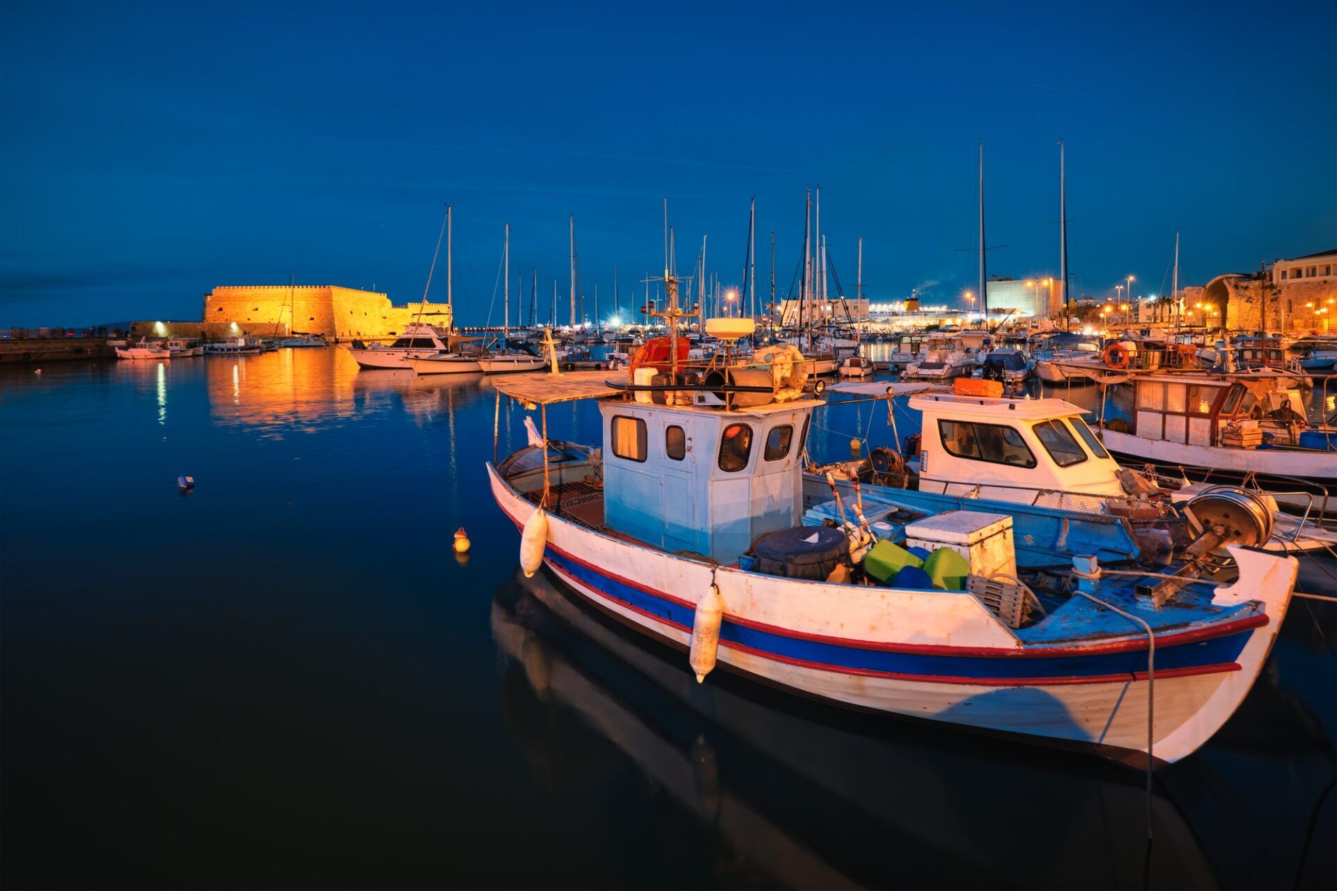 Venetian Fort in Heraklion and moored fishing boats, Crete Island, Greece