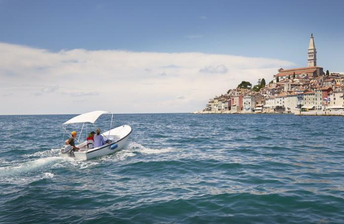 Family with two children in motor boat, Rovinj, Istria Peninsula, Croatia