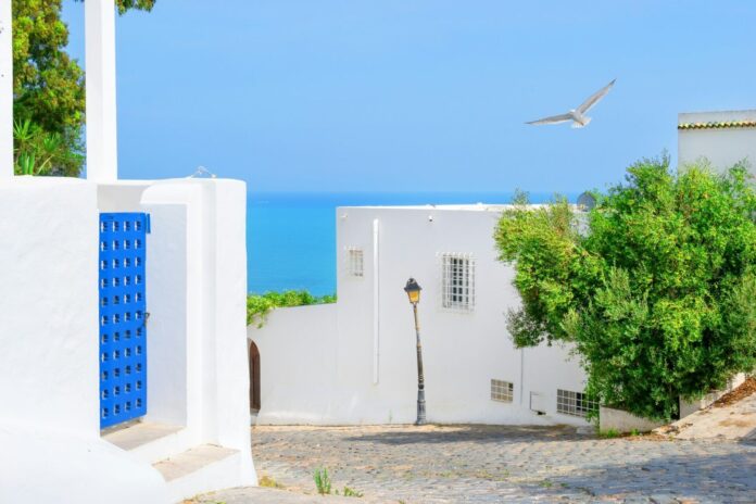 View from street of white with blue city to sea