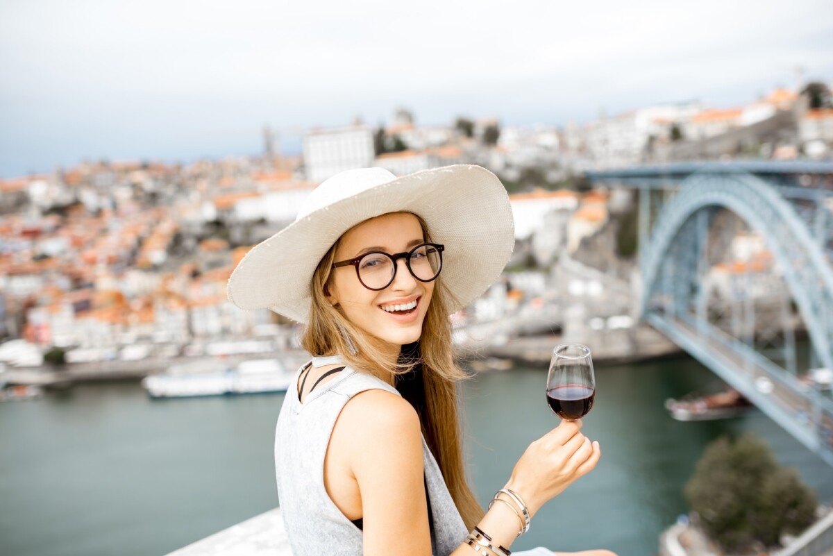 Woman with glass of Porto wine in Portugal