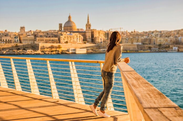 Valletta Malta city Skyline, city skyline Malta Valletta , young woman visit Malta at vacation