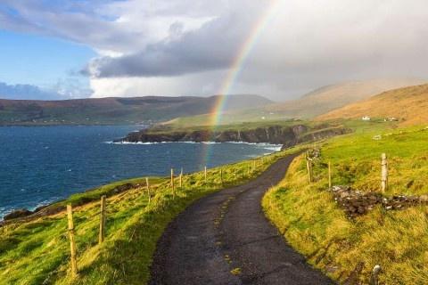Typical-Ireland---Coast-green-grass-blue-skies-clouds-rain-coming-rainbow-Irlandia-shutterstock_392