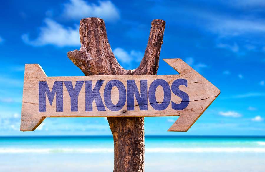 0.-Mykonos-wooden-sign-with-beach-background-shutterstock_269463272