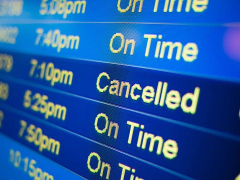 Airport-flight-cancelled.-Airport-arrival-and-departure-monitor-sign-showing-on-time-and-cancelled-flight-status-shutterstock_295152131-1