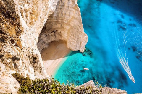 0.-Navagio-beach-with-boats-on-Zakynthos-islans-in-Greece-shutterstock_331462181