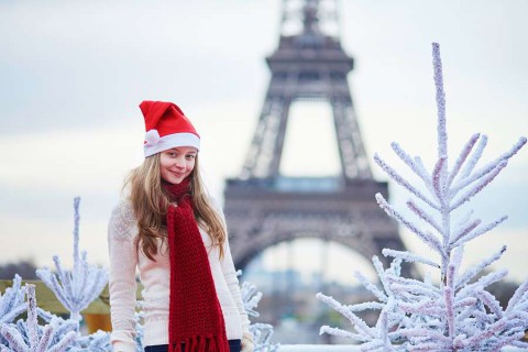 Pary-Girl-in-Santa-hat-near-the-Eiffel-tower-in-Paris-during-Christmas-time-shutterstock_305256767