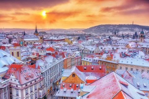 Prague-in-Christmas-time-classical-view-on-snowy-roofs-in-central-part-of-city.-shutterstock_514073659