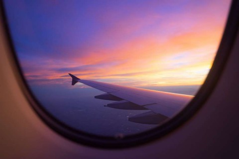 Sunset-sky-from-the-airplane-window-shutterstock_450483874